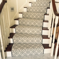 Dark color stairs with carpets by Claghorn professionals